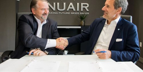Major General Marke F. “Hoot” Gibson (ret), chief executive officer of the NUAIR Alliance (left) signs partnership agreement with Marc Kegelaers, CEO of Unifly (right)