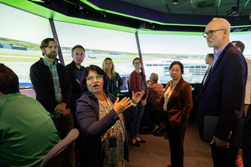 (Front left) Savvy Verma at NASA’s Ames Research Center in California’s Silicon Valley explaining the latest air traffic management simulation to visitors. (credit NASA)