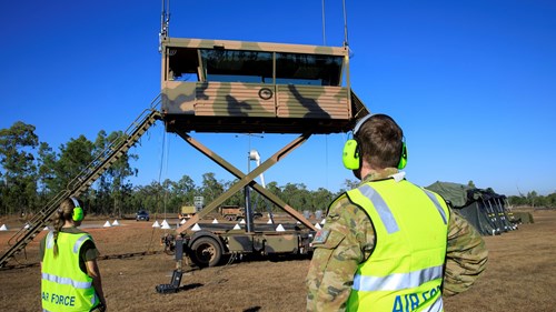 Leading Aircraftwoman Rebecca Hay and Corporal Thomas Geraghty raise the transportable air operations tower, at RAAF Base Scherger in Queensland, to commence operations on Exercise “Talisman Sabre 2021.” (Image: Commonwealth of Australia)